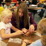 Christ Lutheran School Photo - Upper and lower grade students work together on art project.